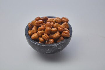 Fava beans (foul) shot on white background.