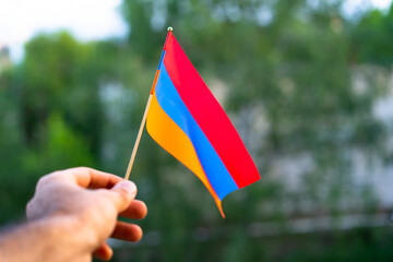 Hands holding armenian flag
