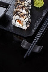 Sushi on black background. Perfect for creating sushi restaurant menu.