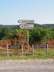 A sign showing the destination on the way to the Longchamp Chapel