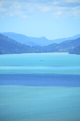 Fototapeta na wymiar Beautiful gradient blue colour of Picton, New Zealand. Picton - The heart of the Marlborough Sounds
