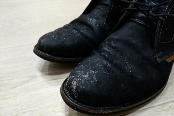 Wet dirty shoes after the street. The onset of autumn and cold weather.