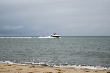 Fototapeta premium White speedboat in the waters of the Baltic Sea