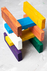 Toy house of colorful wooden blocs, vertical image. Nobody