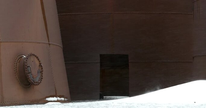 CU Rusty old whaling station at Deception Island in snowfall / Antarctic Peninsula, Antarctica