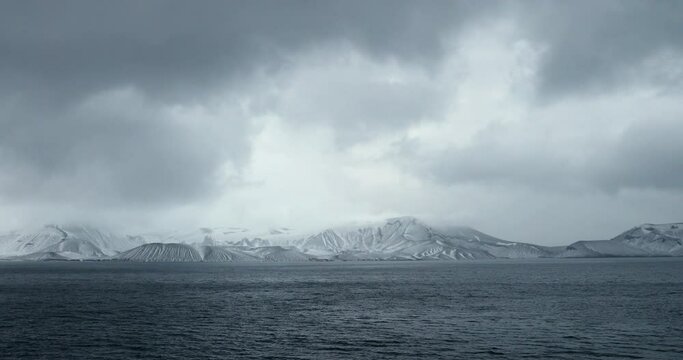 WS Clouds over Deception Island and sea at dusk / Antarctic Peninsula, Antarctica