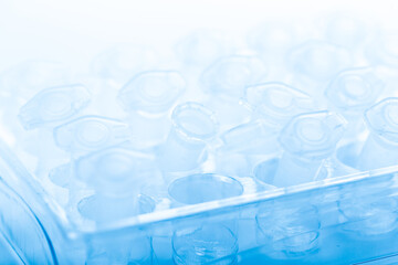 pipette and scientific laboratory test tubes in a genetic laboratory. study of a virus or vaccination.