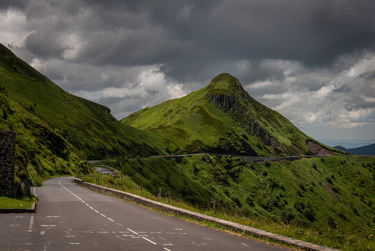 mountain road or  pass , pas de peyrol ,auvergne, cantal France , landcape , with cloudy sky ,walking ,adventure holiday.
