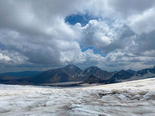 Fototapeta na wymiar Snowy rocky slopes of the northern Elbrus region.