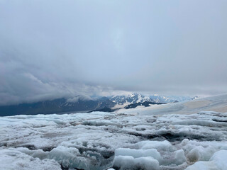 Beautiful winter mountain landscape. Snowy rocky slopes of the northern Elbrus region.