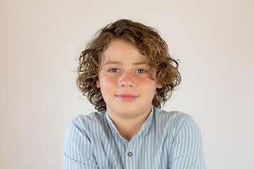 Portrait of a smiling boy with a curly hair