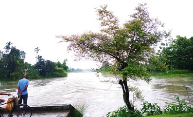 couple on the river bank. This image shoot date is 11 june 2020 in India district barpeta village baniarapara. 