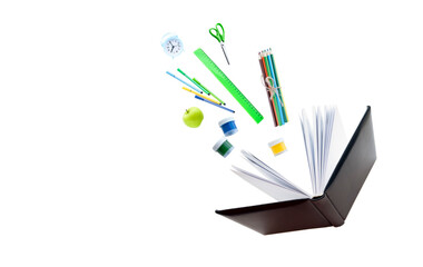 school supplies fly out of the book. training concept. isolated background