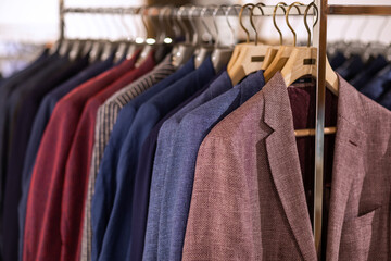 Obraz premium Close up of luxurious style gentlemen suit on hangers