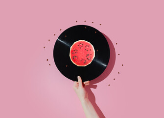 Vinyl record and watermelon on a pastel background. Fun concept of good mood. - 364763203