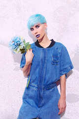 Fashion Girl with blue short hair. Trendy colours hair style concept
