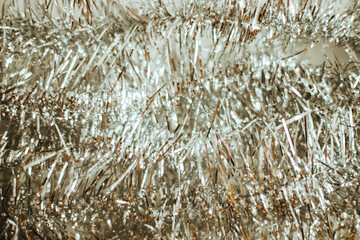 Silver and gold tinsel. Holiday decorations. Christmas background.