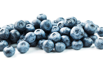 Blueberries isolated on a white background. A scattering of ripe, juicy, delicious and healthy berries.