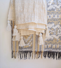 soft knit beage blankets on white background. Details of modern boho, scandinavian style .