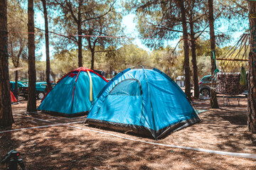 tents in the camping area. camping new normal new vacation. Camping tent in tree area.