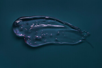 Liquid cream gel foam gommage mask cosmetic smudge texture dark blue background