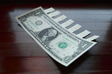 one dollar bill with stickers