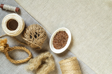 Obraz na płótnie Canvas Flax products, oil, seeds on linen