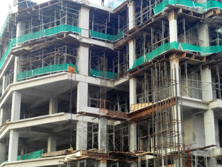 SEREMBAN, MALAYSIA -MARCH 7, 2020: Steel reinforced concrete structure is built at the construction site. Built using formworks made of wood and plywood. Manually build by the workers.