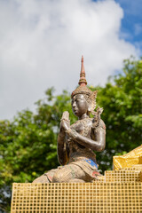 Obraz premium Traditional figure of deva (Angel) , clasping hand , in Thai style at the public temple of southern region of Thailand.