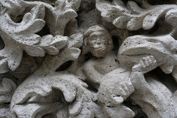 Elements of architectural decorations of buildings. Old stucco work close up shot. Ancient plaster work. Stucco background. Stone ornaments texture. 