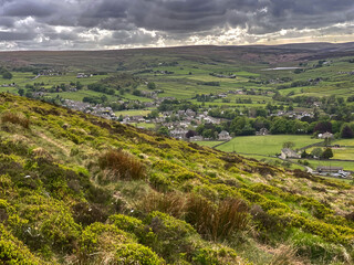Landscape view of countryside, between, Hebden and Haworth, with heavy cloud above