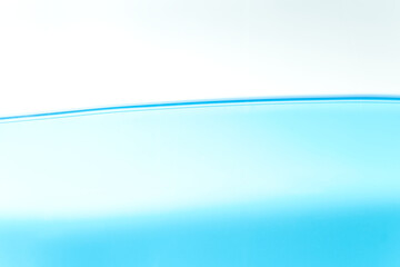 Blue water surface on a white background with spaces for text.