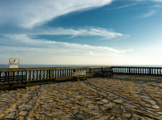 Lookout point with stone floor and soft hazy clouds