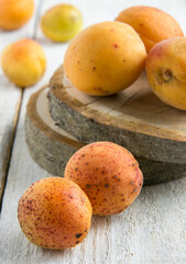 Apricots on a white wooden table