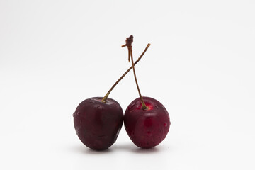 Fresh rip red cherry on withe background