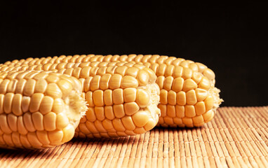 Sweet fresh corn on a wooden background