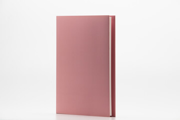 Pink Hardback Book With Copy Space Isolated on White Background