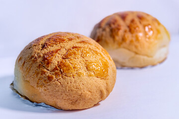 Pineapple bun isolated on white background. Hong Kong dim sum. Cantonese cuisine. 