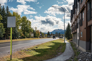 Fototapeta premium The street of Canmore town with building and car on highway in Canada