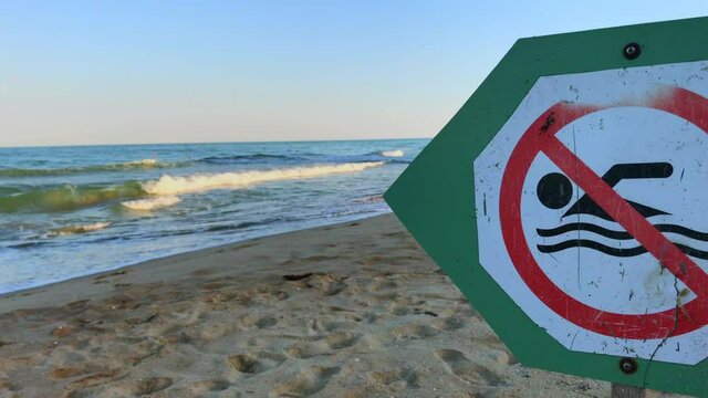 A close-up of no swimming sign, the sea revealed as background, no people in the water, Black Sea, Albena, Dobrich, Covid-19 situation