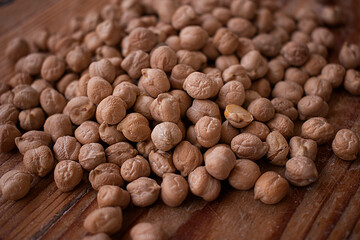 Chickpea grains on wooden background