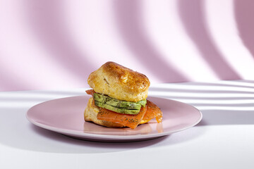 Assortment of homemade scones with ham, cheese, avocado, salmon, cream cheese and strawberry jam