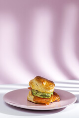 Assortment of homemade scones with ham, cheese, avocado, salmon, cream cheese and strawberry jam