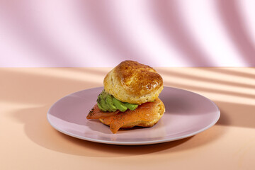 Assortment of homemade scones with ham, cheese, avocado, salmon, cream cheese and strawberry jam