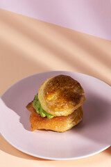 Assortment of homemade scones with ham, cheese, avocado, salmon, cream cheese and strawberry jam