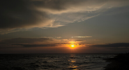  Seascape at dusk. The sun sets over the sea. Copy space for text.