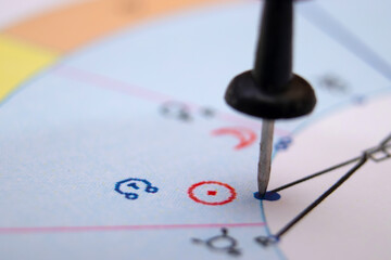 Setting a confusing astrological task. Symbols of zodiac signs, planets, aspects.