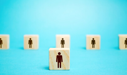 A block man stands out from a row number of people. Leader, leadership skills. Filling of vacancies...