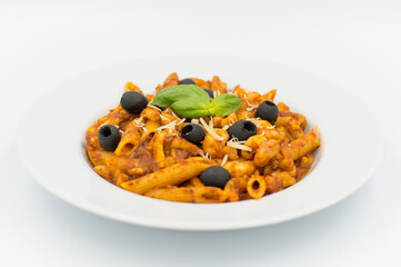  Penne pasta with chicken, olives and vegetables in red tomato sause 
