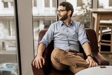 On focus stylish man look away with blurred background